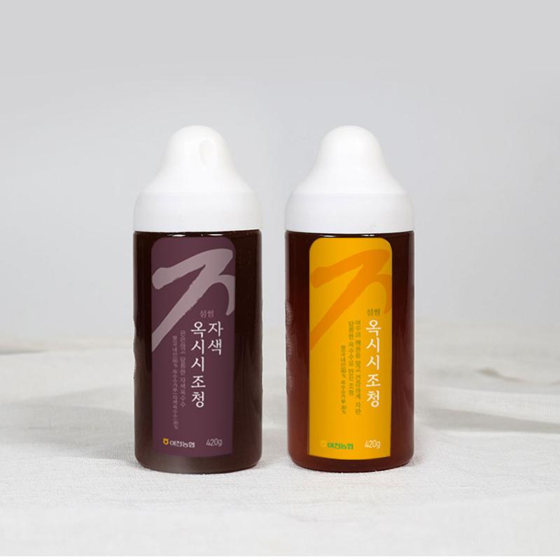 예쁜 병에 담긴 자색 옥시시조청과 옥시시조청 제품사진